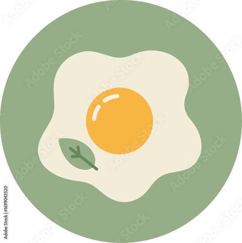 Close-up of a fried egg with bright yellow yolk and runny white on light green background with a small green leaf