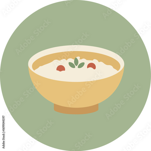 Close-up of yellow cereal bowl with milk, red berries, and green leaf on light green background