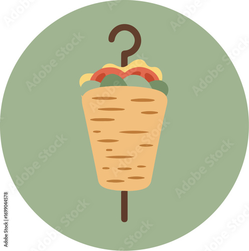 Grilled kebab or shawarma wrap with meat, lettuce, and vegetables on a wooden skewer against a green background