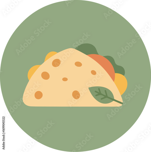 Close-up of a generously filled wrap with lettuce, tomato, cheese, and basil on a green background