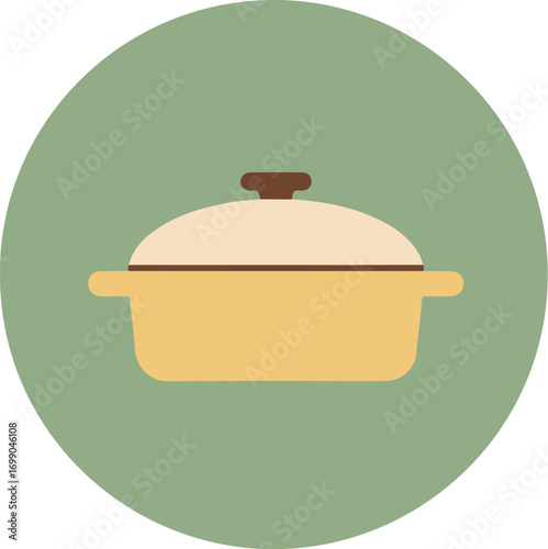 Rustic yellow cooking pot with brown handles and lid on green background