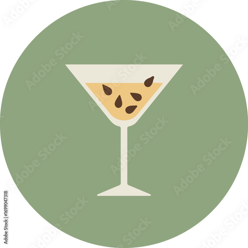 Classic martini glass with light brown cocktail and dark brown garnish on light green background