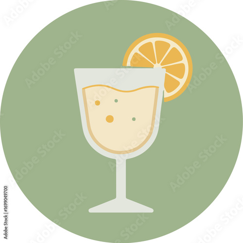 Tall elegant cocktail glass with orange slice on rim against green background