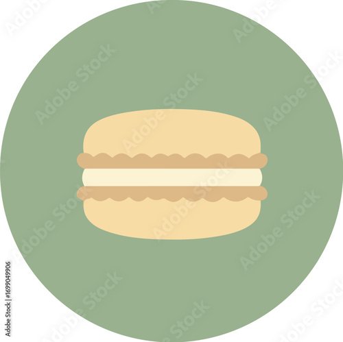Single macaron with light beige exterior and creamy white filling on light green background