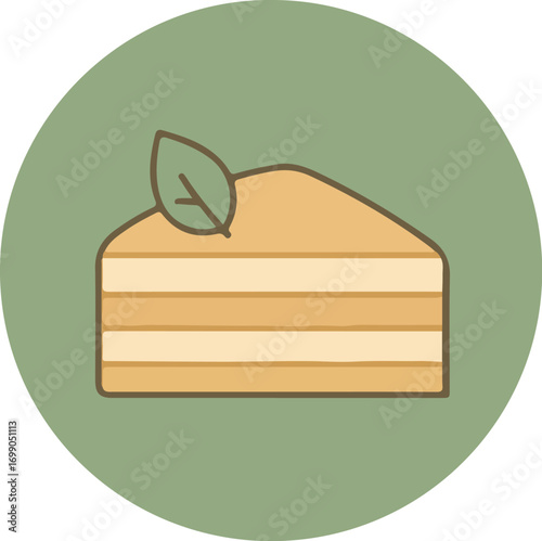 Close-up of a layered orange cake slice with a green leaf on a solid green background