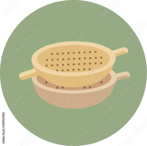Beige strainer with dual handles on a light brown pot with dark brown specks on a light green surface