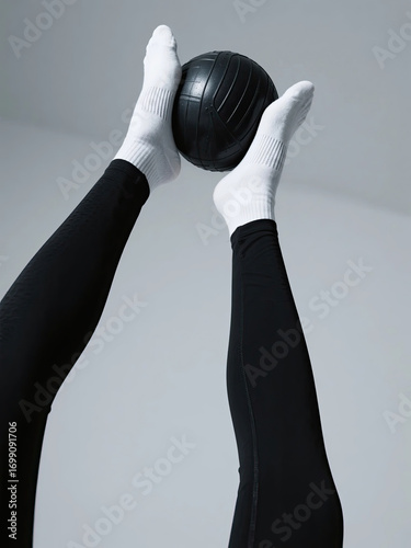 Wallpaper Mural Legs in activewear holding a medicine ball for a core workout. Torontodigital.ca