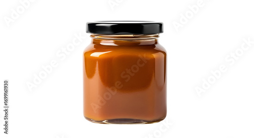 Caramel Spread in Glass Jar isolated on white background