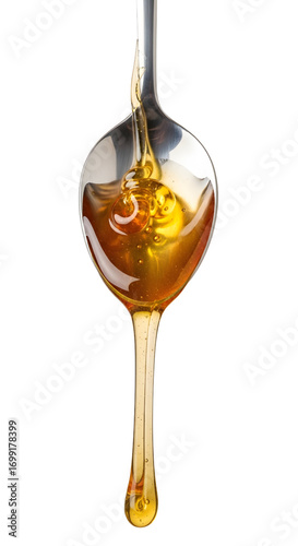 Honey dripping from spoon isolated on white background