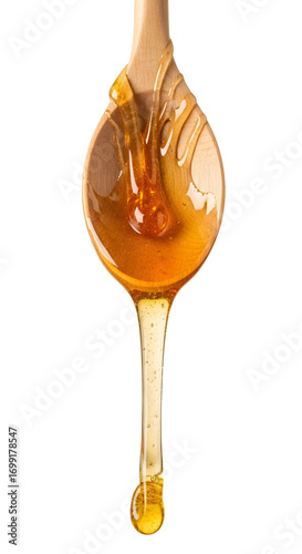 Honey dripping from spoon isolated on white background