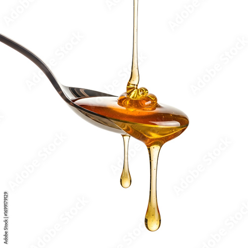 Honey dripping from spoon isolated on white background