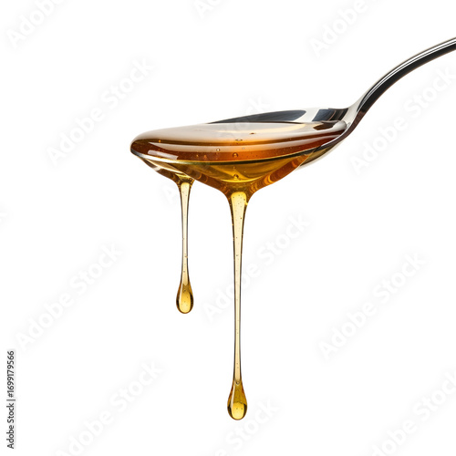 Honey dripping from spoon isolated on white background