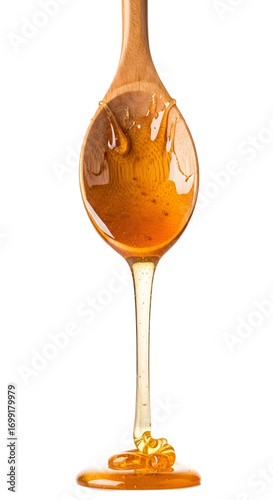 Honey dripping from spoon isolated on white background