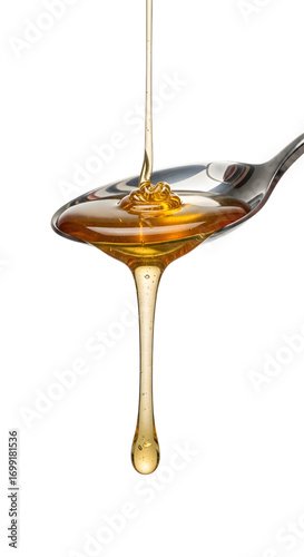 Honey dripping from spoon isolated on white background