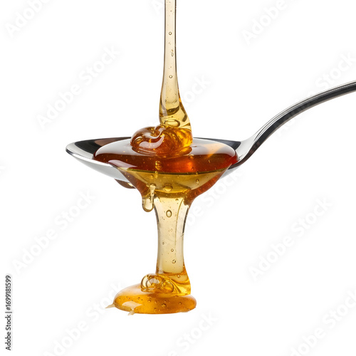 Honey dripping from spoon isolated on white background
