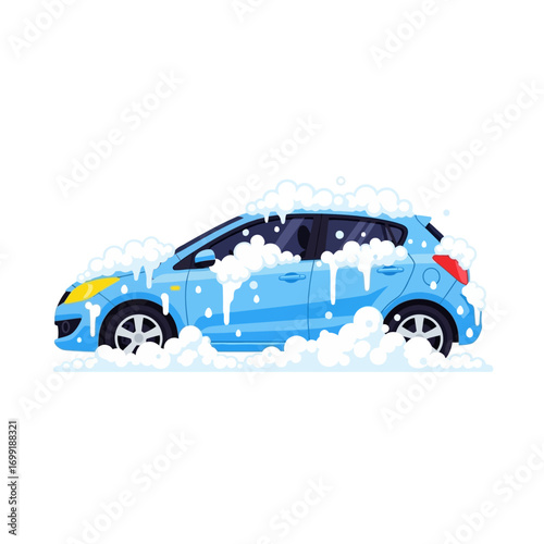 A light blue car covered in soap suds during a car wash.