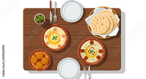 Middle Eastern feast featuring hummus, falafel, and pita on wooden table