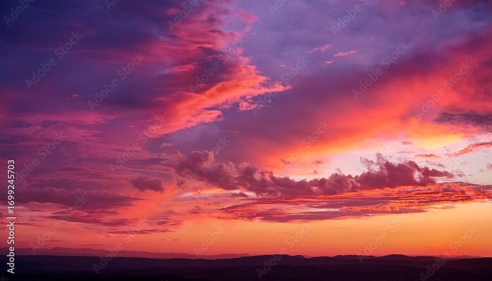 Fototapeta premium A Beautiful Sky With A Pink And Orange Sunset