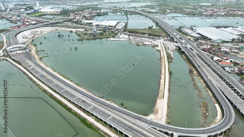 Extensive elevated highway network connecting urban areas across diverse wetlands landscape