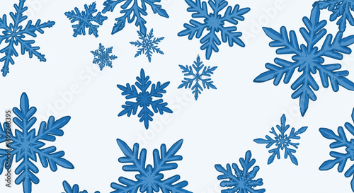 Blue snowflakes scattered across a white background creating a winter scene