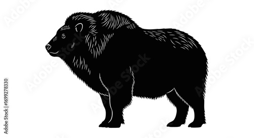 Black silhouette of a shaggy bison standing side view