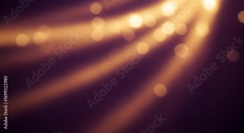 Soft Golden Light Rays With Bokeh Effect On A Dark Background