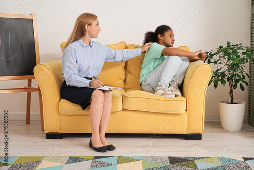 Female psychologist working...