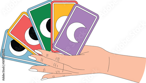 Hand holding colorful cards with moon and eye symbols