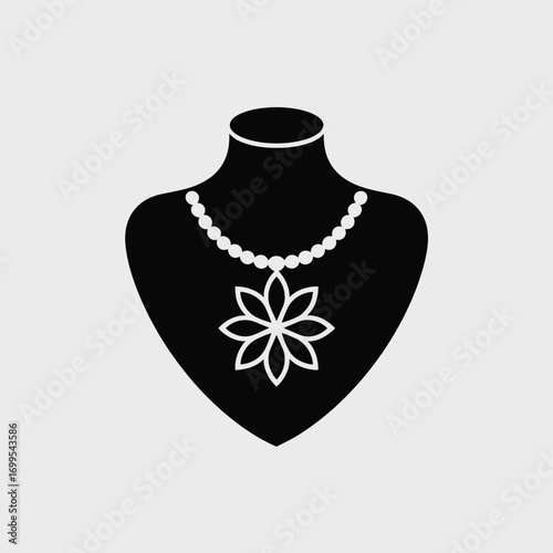 Black jewelry display with pearl necklace and floral pendant vector