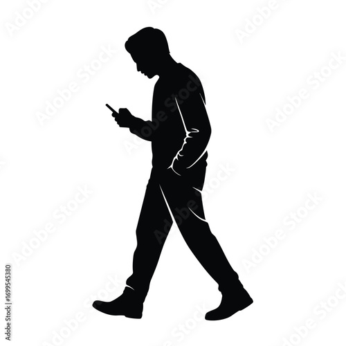 Black silhouette of a man walking forward holding a mobile device mobile phone
