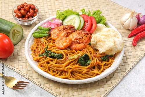 Schilderij op canvas Mie Aceh is a thick yellow noodle dish with spices and shrimp typical of Aceh which is rich in spicy, savory and thick flavor from the curry sauce