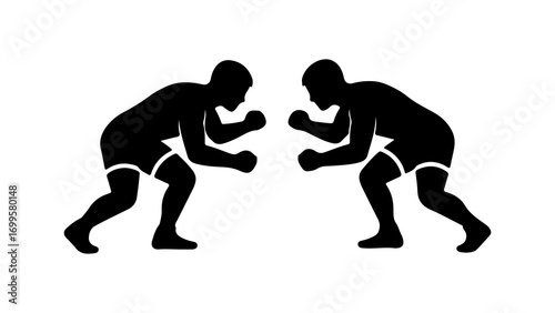 Two wrestlers in silhouette ready for a match.