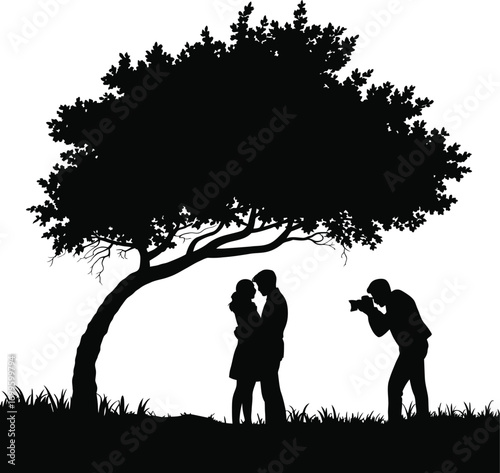 Silhouette of a photographer capturing a couple s special moment