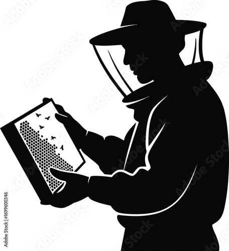 Silhouette of a beekeeper tending to a honeycomb frame with bees