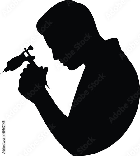 Tattoo artist holding tattoo machine silhouette design
