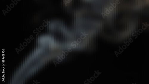 Mysterious ethereal smoke swirling and dissipating in abstract atmospheric patterns creating a dark and smoky texture for dramatic effect and design backgrounds