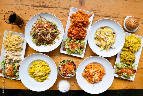Delicious meat kebab with fresh vegetable salad served with variety of Turkish dishes and appetizers. Top view of assorted Turkish food and meze, tasty and healthy Mediterranean cuisine. Top view.