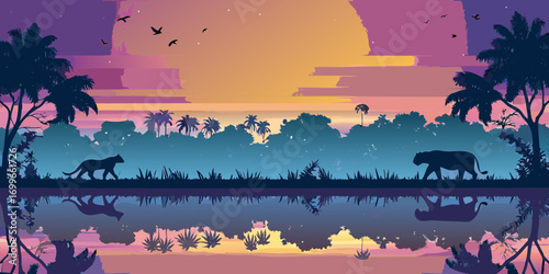 Silhouette of panthers walking by a reflecting lake at sunset