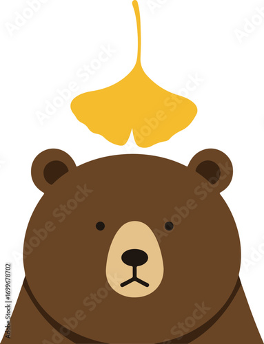 A ginkgo leaf falls from a bear's head.