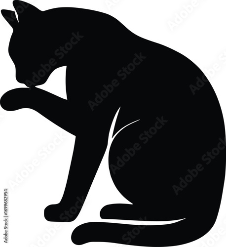 silhouette, grooming cat licking paw, seated