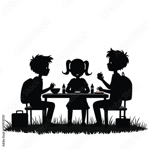 Children eating lunch at a picnic table with backpacks silhouette