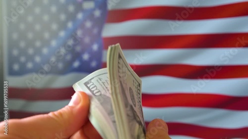 Man counting money. Dollar banknotes in hands with usa flag on background. 4k footage UHD 3840x2160