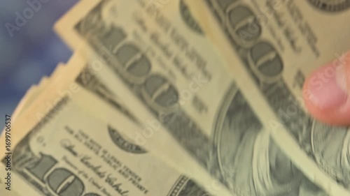 Man counting money. Dollar banknotes in hands with usa flag on background. 4k footage UHD 3840x2160
