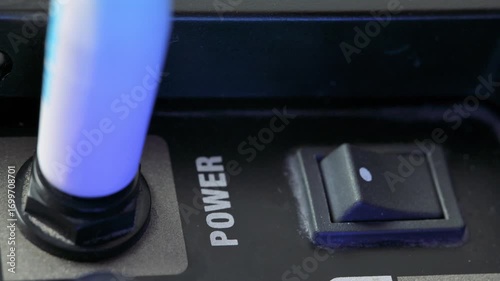 Man turning on power knob on amplifier. 4k video footage UHD 3840x2160