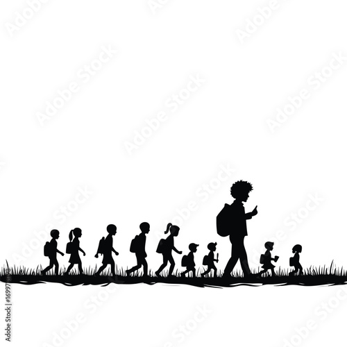 Large group of children and adult walking in silhouette