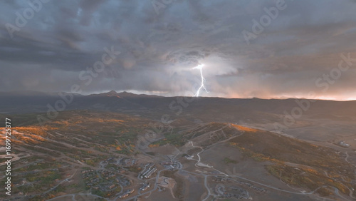 Beautiful drone view sunset over lightning Colorado mountains