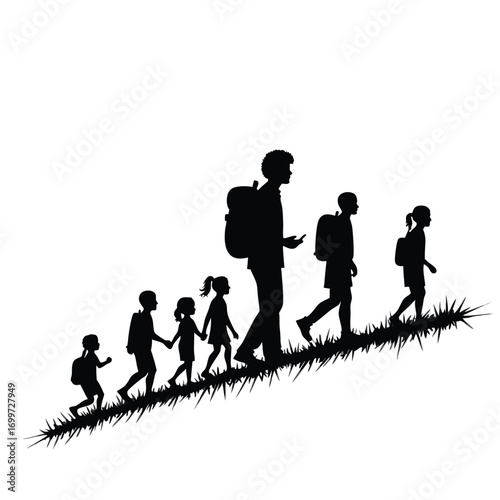 Silhouette of people with backpacks walking up a grassy slope