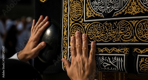 Hands Touching the Embroidered Kaaba Cloth with Islamic Calligraphy