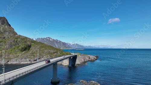 Wallpaper Mural Light traffic driving across Djupfjord Bridge on E10 highway south of Reine toward Moskenes in Lofoten, Norway. Torontodigital.ca
