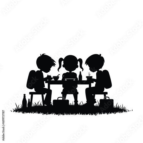 Three children eating at a picnic table with backpacks and lunchboxes